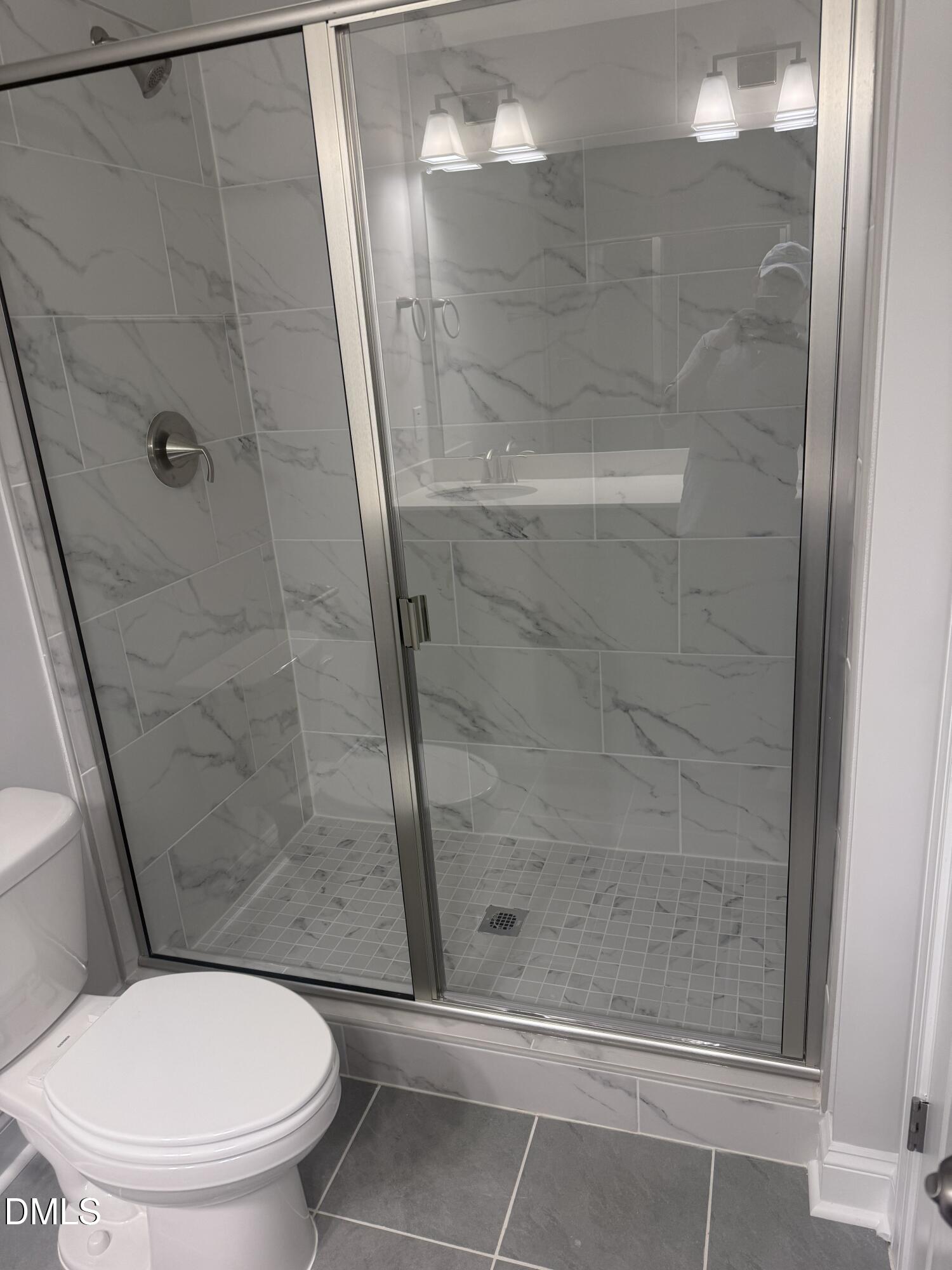 1920 Fishamble Street Fuquay-Varina, NC 27526 - Photo 14 of 23 a bathroom with a shower and toilet