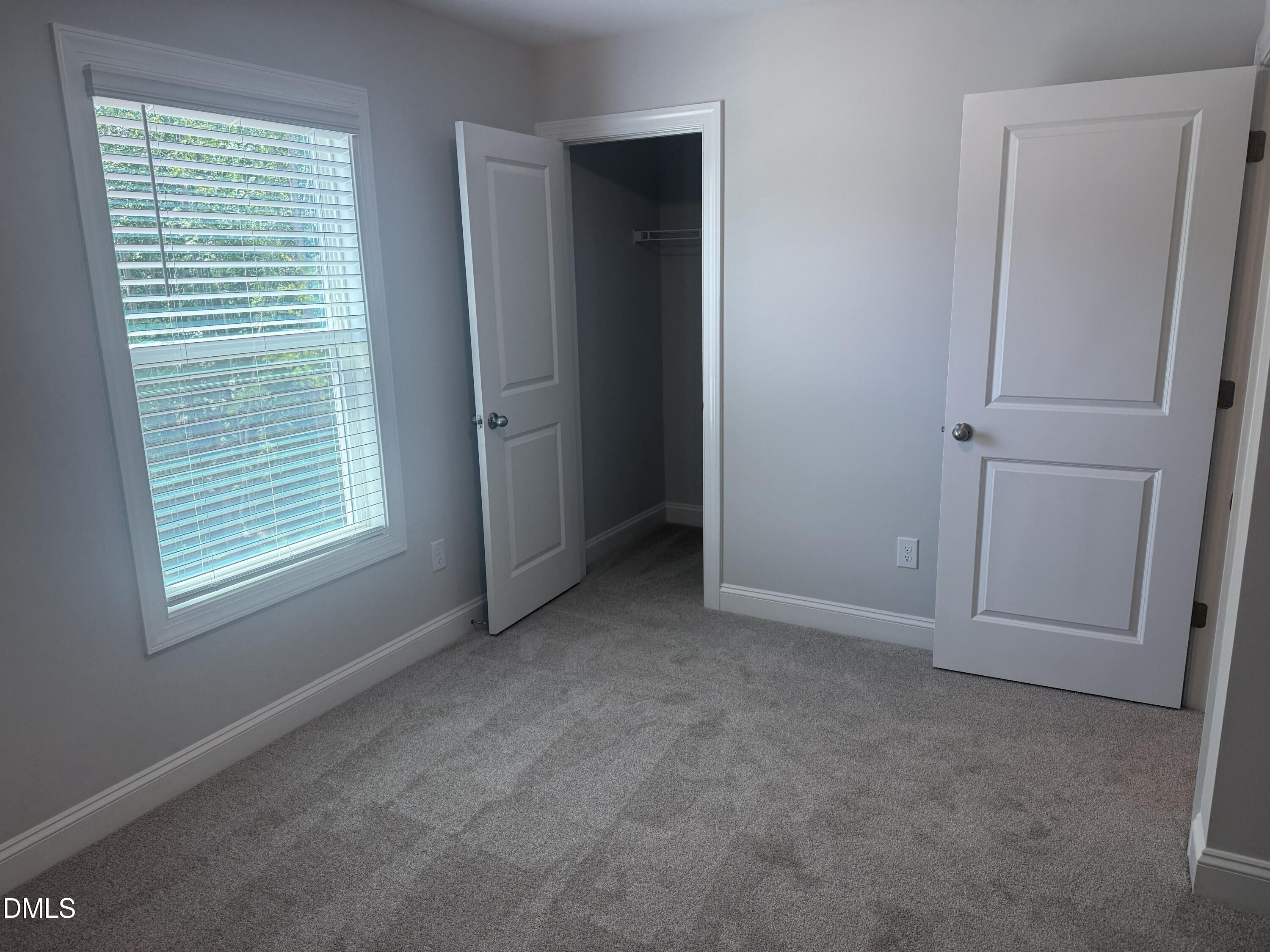 1920 Fishamble Street Fuquay-Varina, NC 27526 - Photo 17 of 23 an empty room with windows and closet