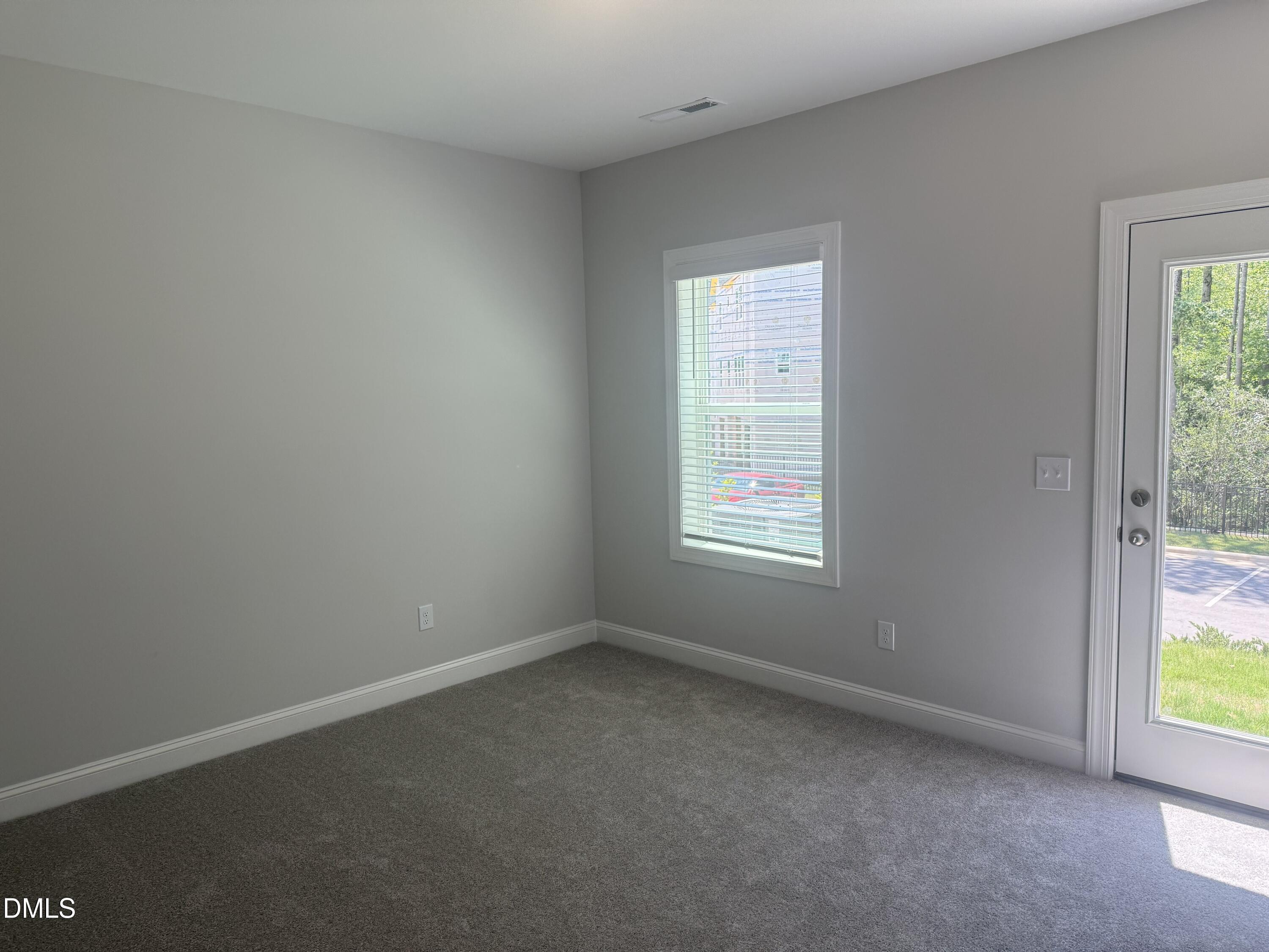 1920 Fishamble Street Fuquay-Varina, NC 27526 - Photo 3 of 23 an empty room with windows