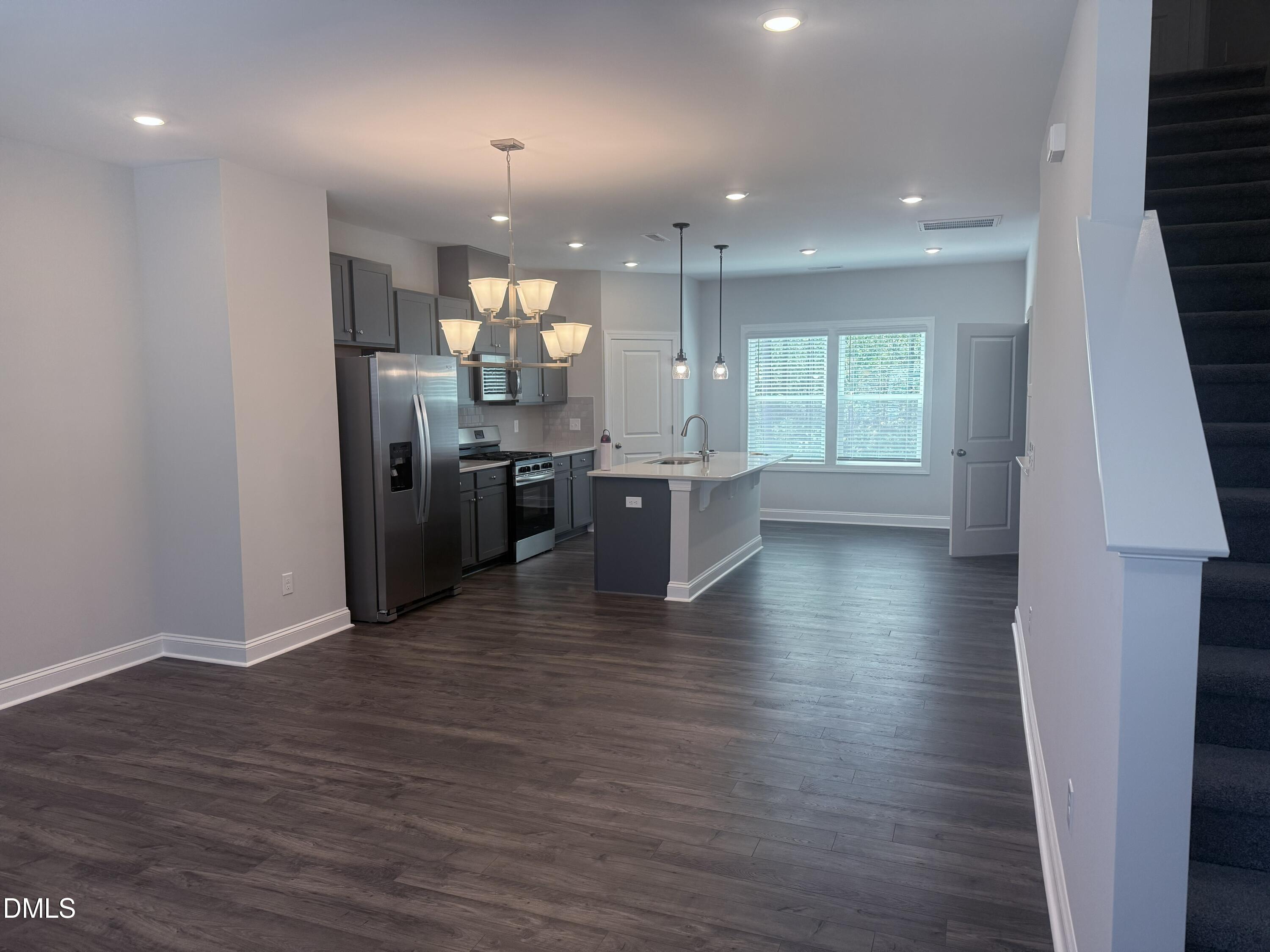 1920 Fishamble Street Fuquay-Varina, NC 27526 - Photo 7 of 23 a view of kitchen and dining room with wooden floor