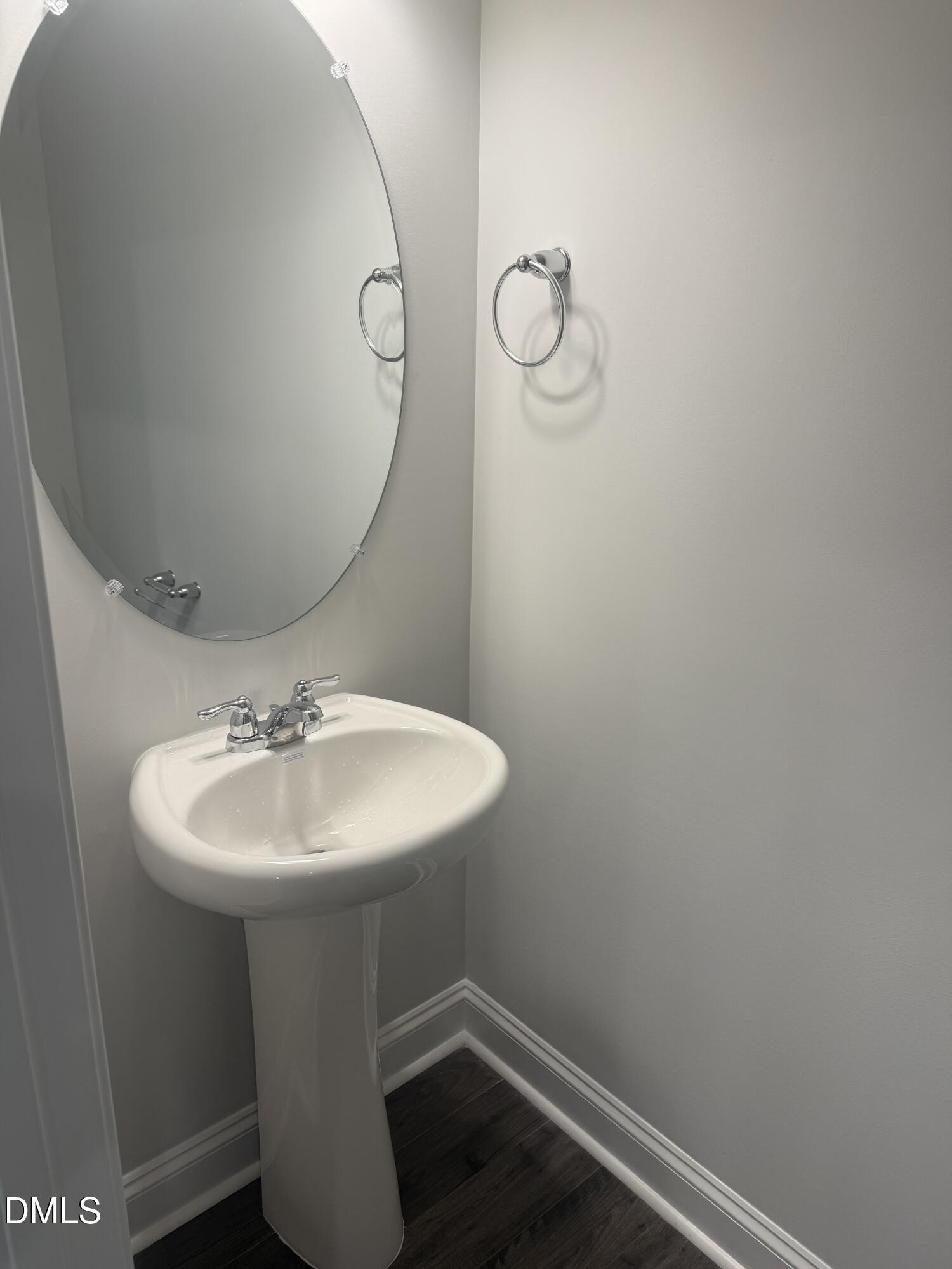 1920 Fishamble Street Fuquay-Varina, NC 27526 - Photo 10 of 23 a bathroom with a sink and mirror