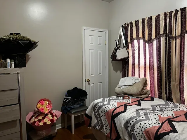 a bedroom with a bed and a closet