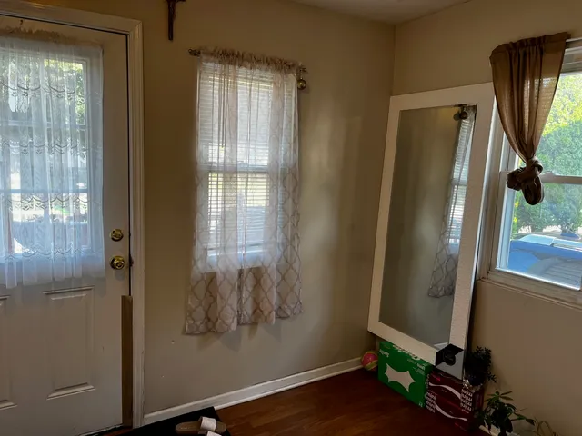 a view of front door with wooden floor
