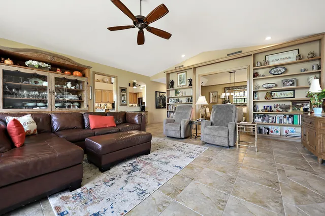 a view of a livingroom with furniture window and wooden floor