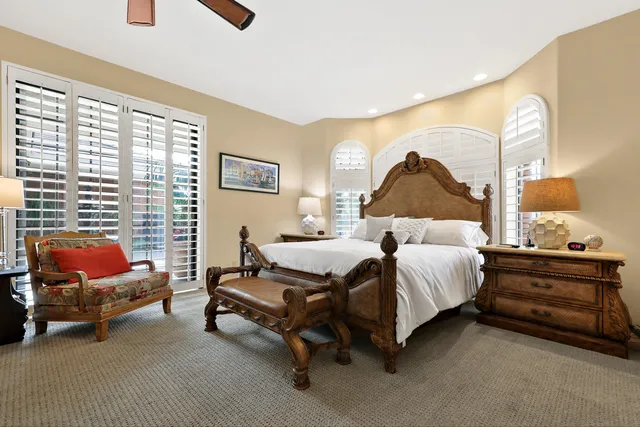 a work room with furniture and a book shelf