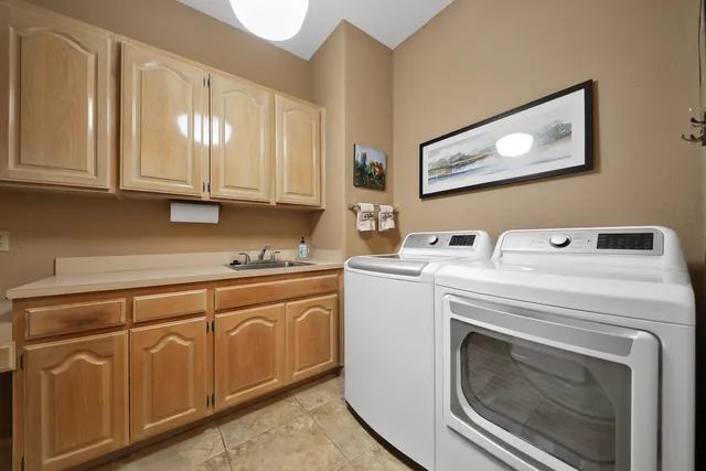 a bathroom with a granite countertop sink a mirror and a shower