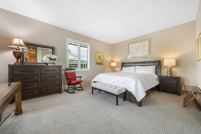 a view of a swimming pool with a patio and a yard