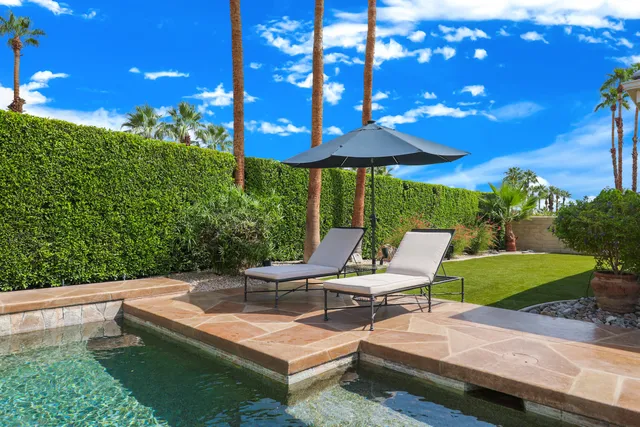 a view of a patio with swimming pool