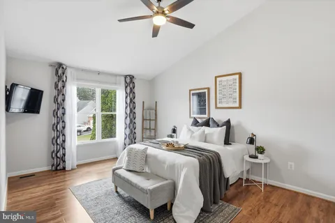 a bedroom with a bed and a couch