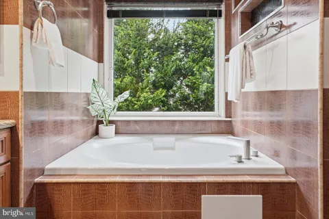 a close view of sink and a bathtub in a bathroom