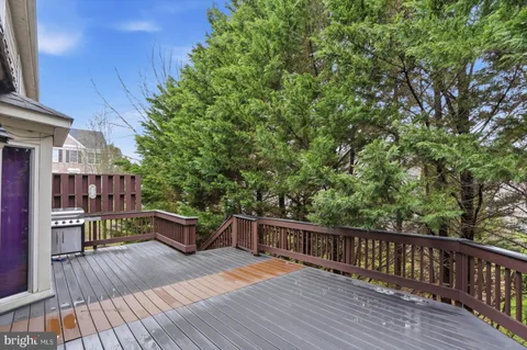 a view of balcony with deck and wooden floor
