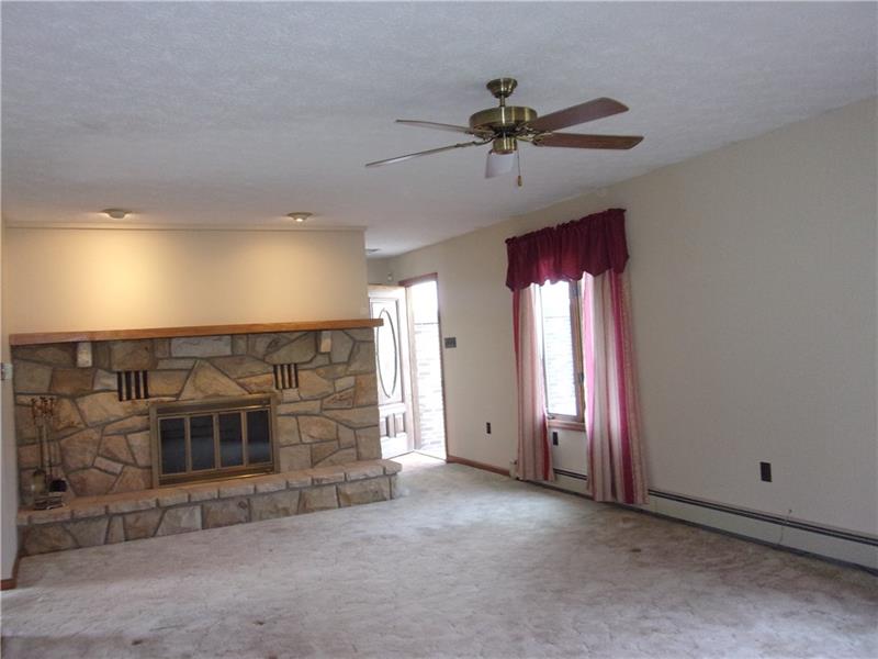 210 Jones Road Valencia, PA 16059 - Photo 2 of 25 Spacious Living Room with beautiful stone fireplace with ventilator for those cold winter nights