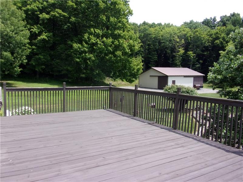 210 Jones Road Valencia, PA 16059 - Photo 4 of 25 View of deck from the Master Bedroom. A 38x34 Pole Building with electric, water and RV hookups. Great place for storage of equipment or for horses!
