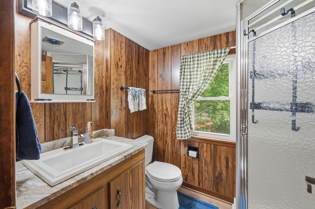 43 Flint Road Tyngsborough, MA 01879 - Photo 20 of 40 a bathroom with a sink toilet and shower
