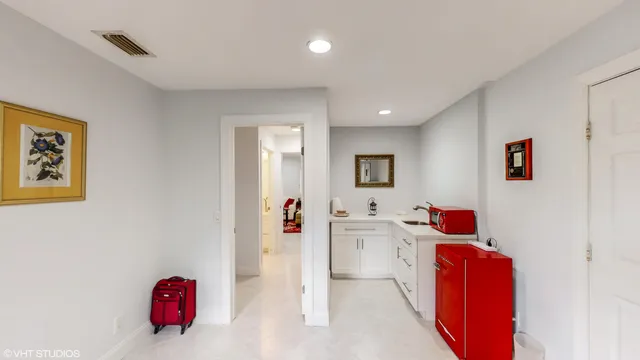 a view of a backyard with table and chairs under an umbrella