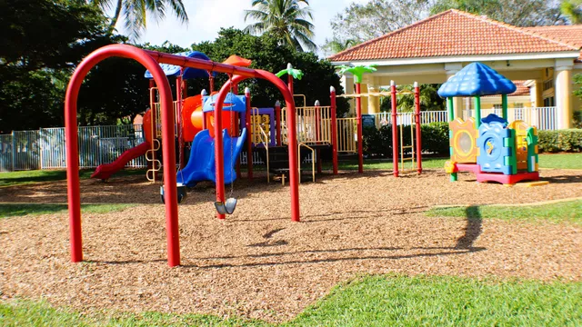 a dining room with furniture large windows and a livingroom