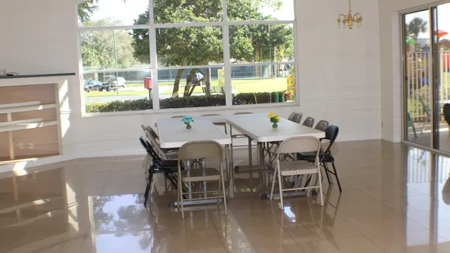 a swimming pool view with a outdoor seating