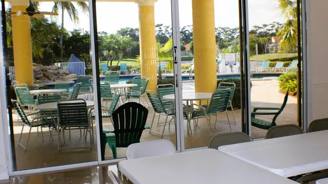 a view of a chairs and table on the wooden floor
