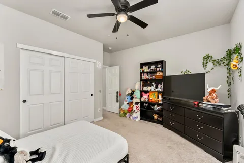 a view of a livingroom with furniture and windows