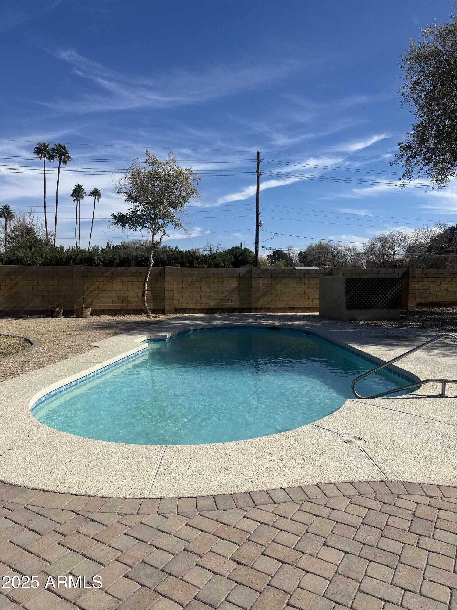 2201 South Evergreen Road Tempe, AZ 85282 - Photo 37 of 42 a view of swimming pool with a yard
