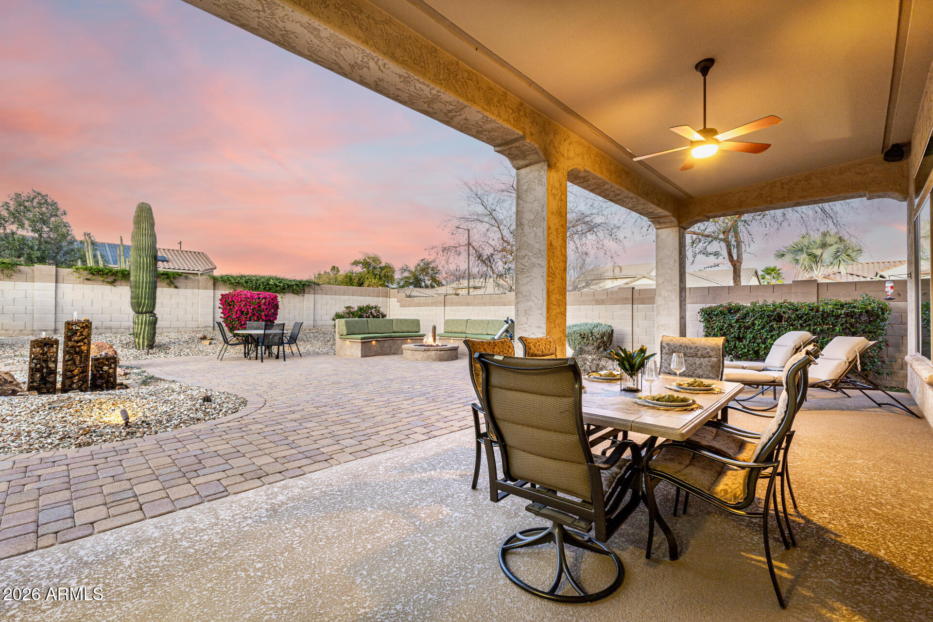 17926 West Griswold Road Waddell, AZ 85355 - Photo 11 of 73 a dining room with furniture and a floor to ceiling window