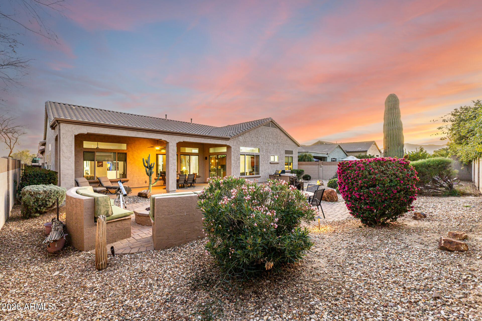 17926 West Griswold Road Waddell, AZ 85355 - Photo 13 of 73 a view of a house with backyard sitting area and garden