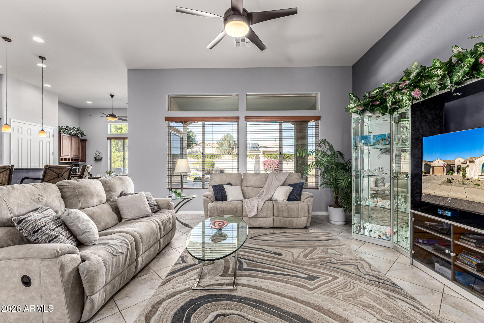 17926 West Griswold Road Waddell, AZ 85355 - Photo 17 of 73 a living room with furniture or couch and a potted plant
