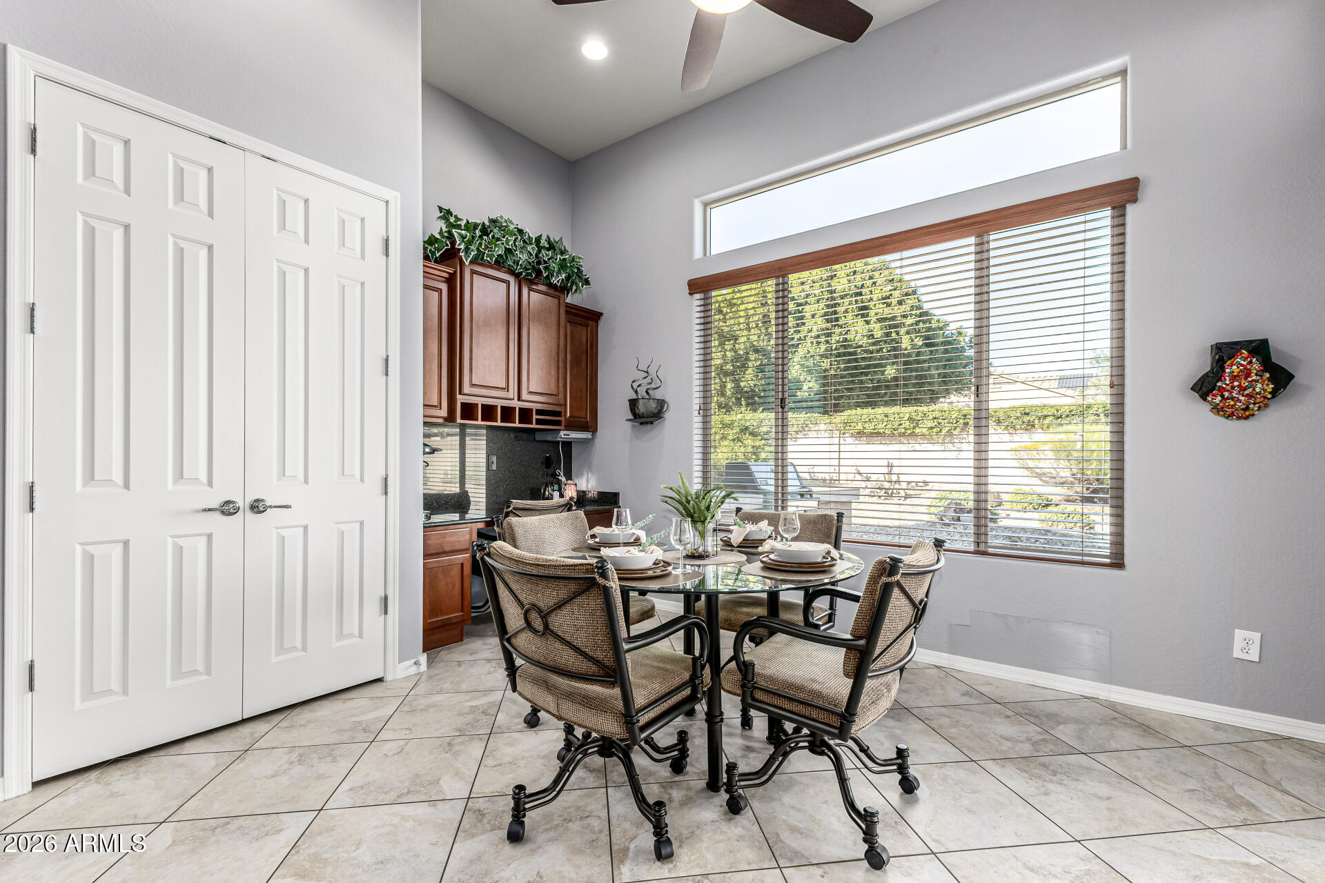17926 West Griswold Road Waddell, AZ 85355 - Photo 19 of 73 a dining room with furniture and window