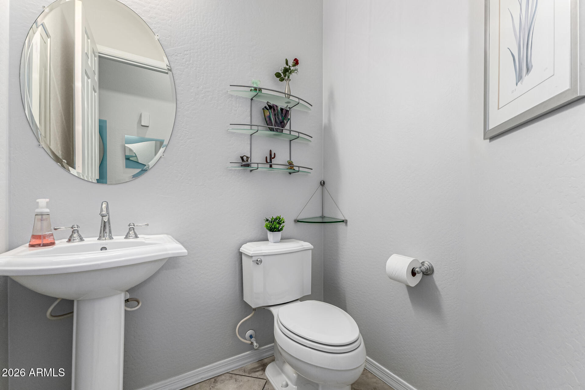 17926 West Griswold Road Waddell, AZ 85355 - Photo 22 of 73 a bathroom with a sink mirror and toilet