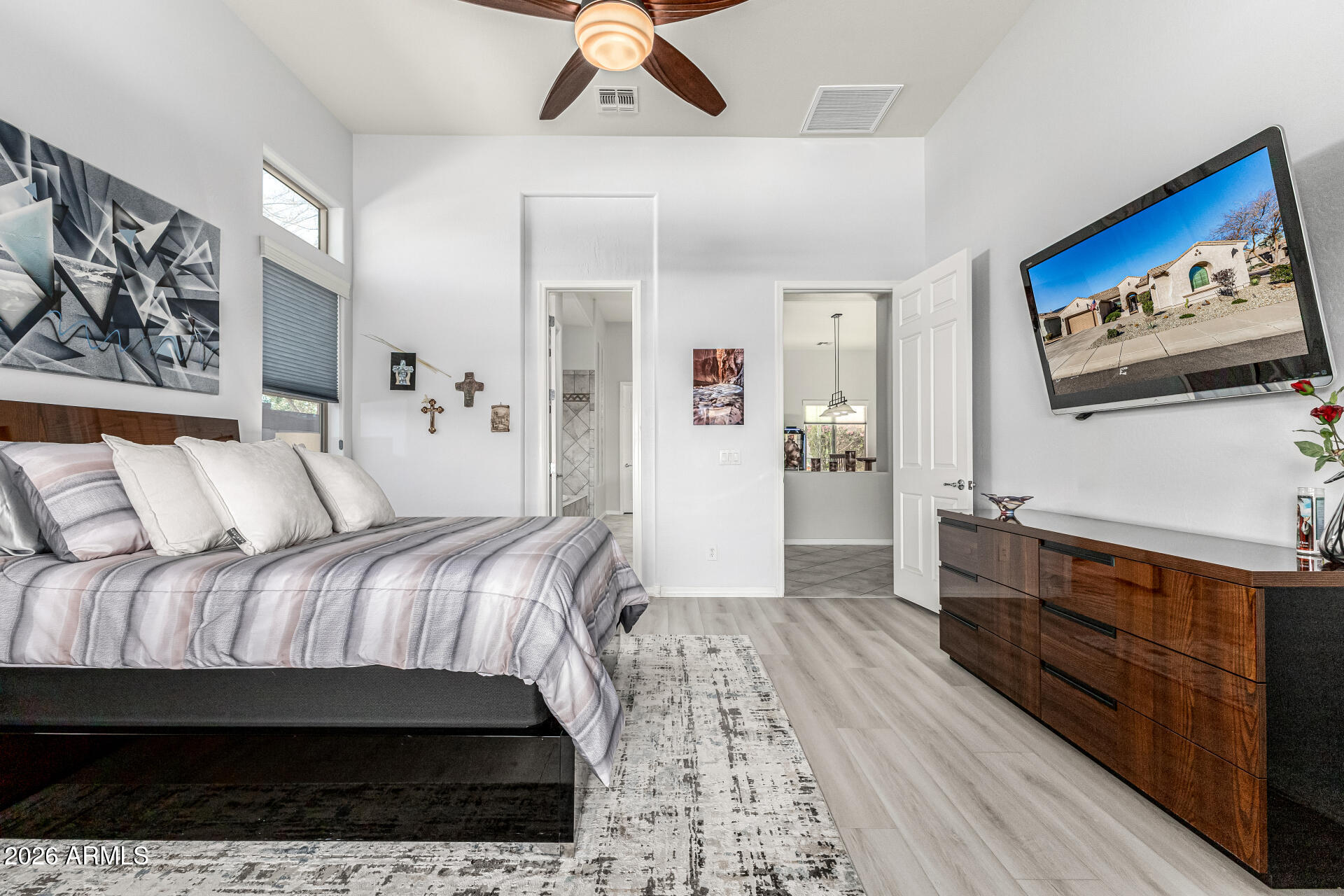 17926 West Griswold Road Waddell, AZ 85355 - Photo 24 of 73 a bedroom with a bed and a dresser