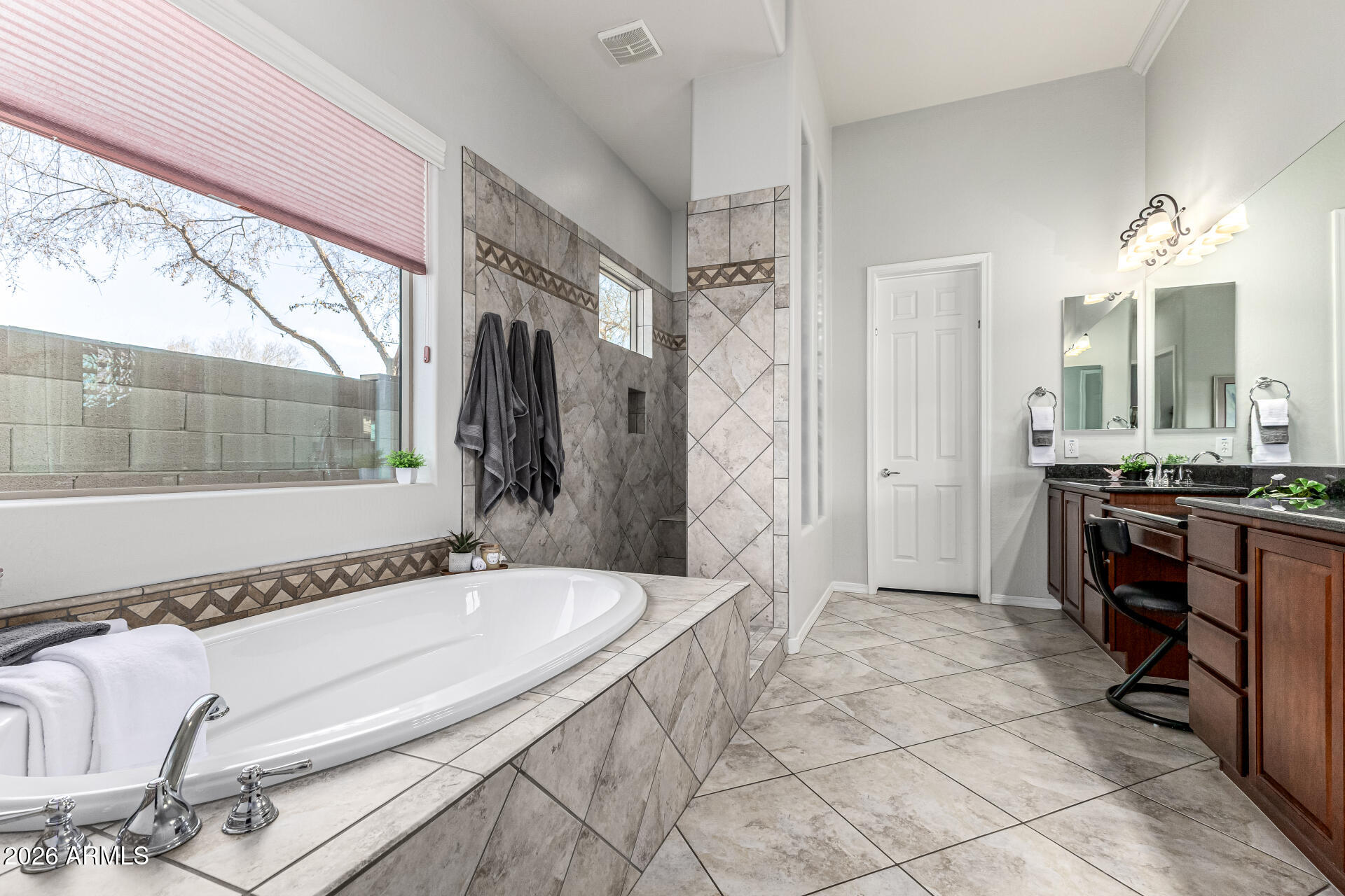 17926 West Griswold Road Waddell, AZ 85355 - Photo 26 of 73 a spacious bathroom with a tub and a sink