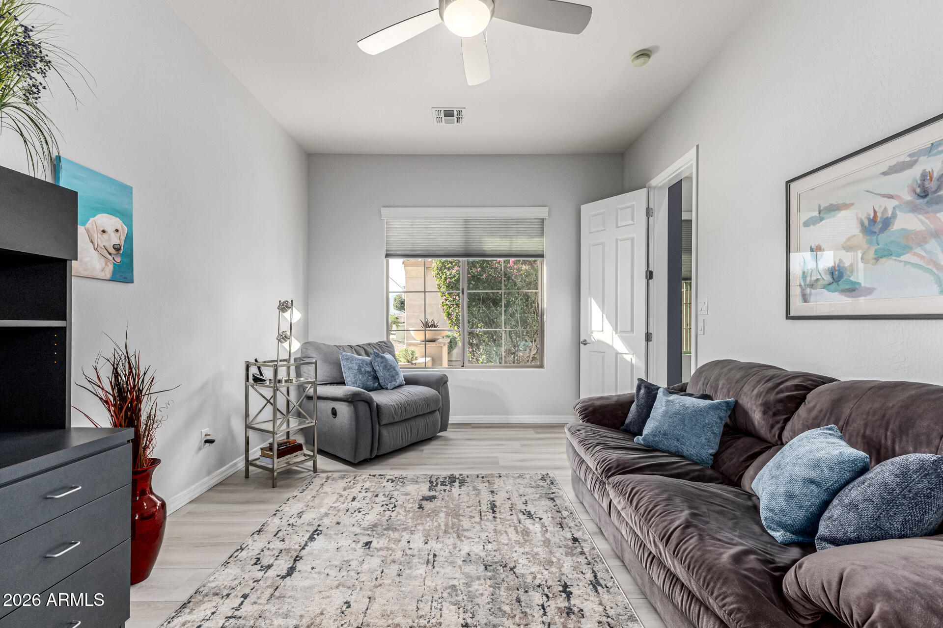 17926 West Griswold Road Waddell, AZ 85355 - Photo 30 of 73 a living room with furniture and a window