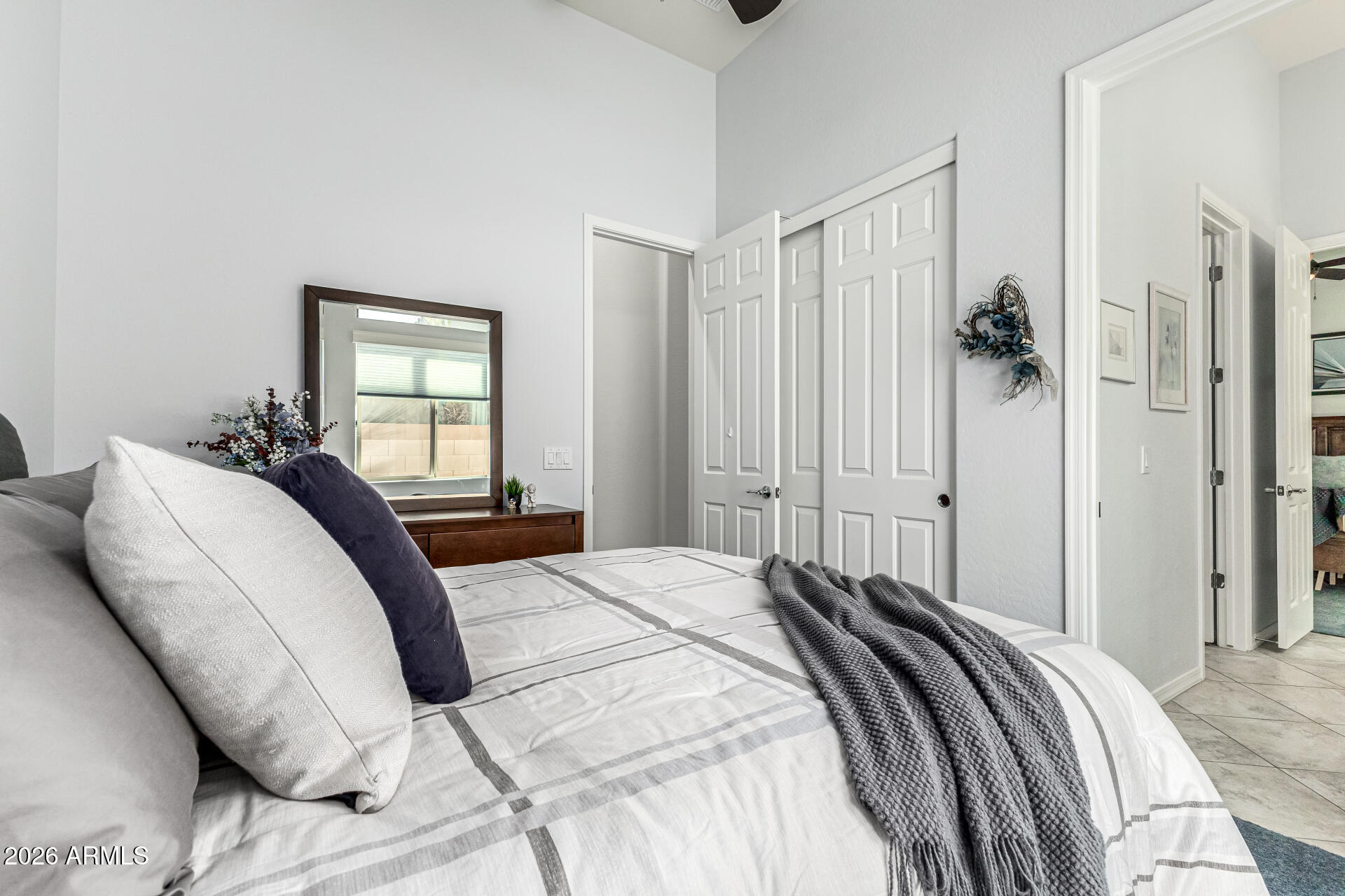 17926 West Griswold Road Waddell, AZ 85355 - Photo 35 of 73 a bedroom with a bed and a window