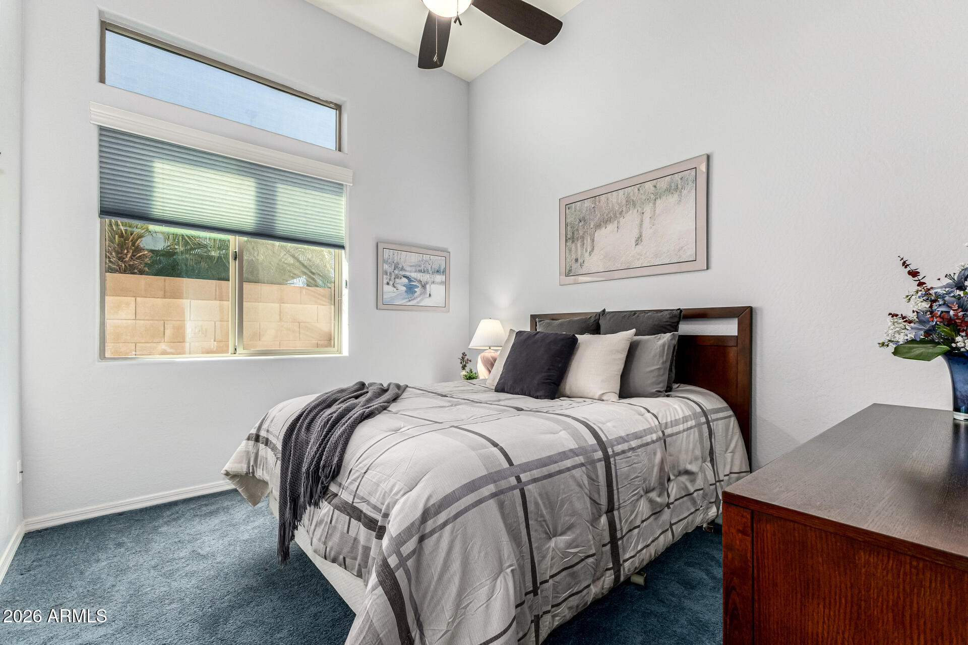 17926 West Griswold Road Waddell, AZ 85355 - Photo 36 of 73 a bedroom with a bed and window