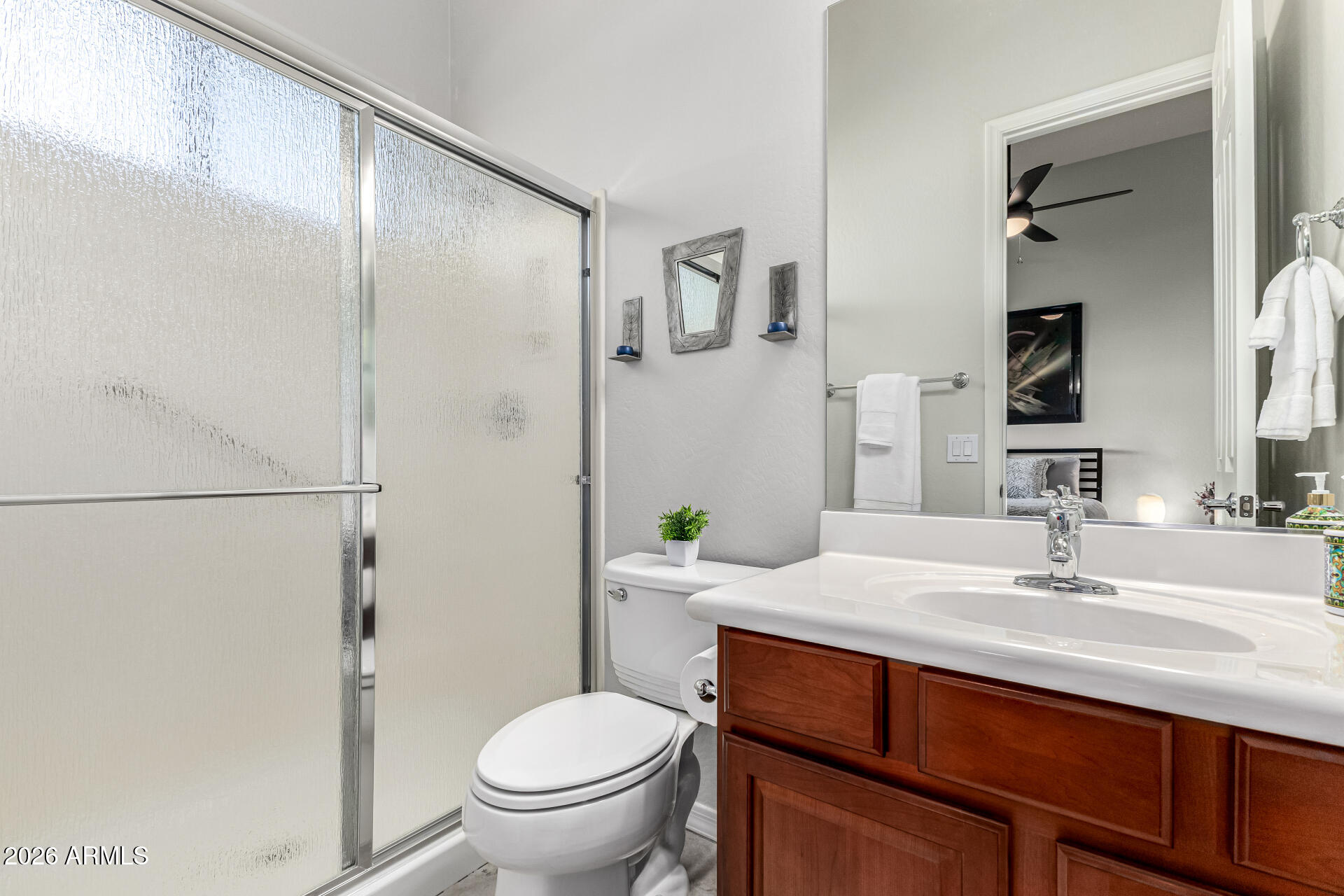 17926 West Griswold Road Waddell, AZ 85355 - Photo 39 of 73 a bathroom with a sink toilet and shower