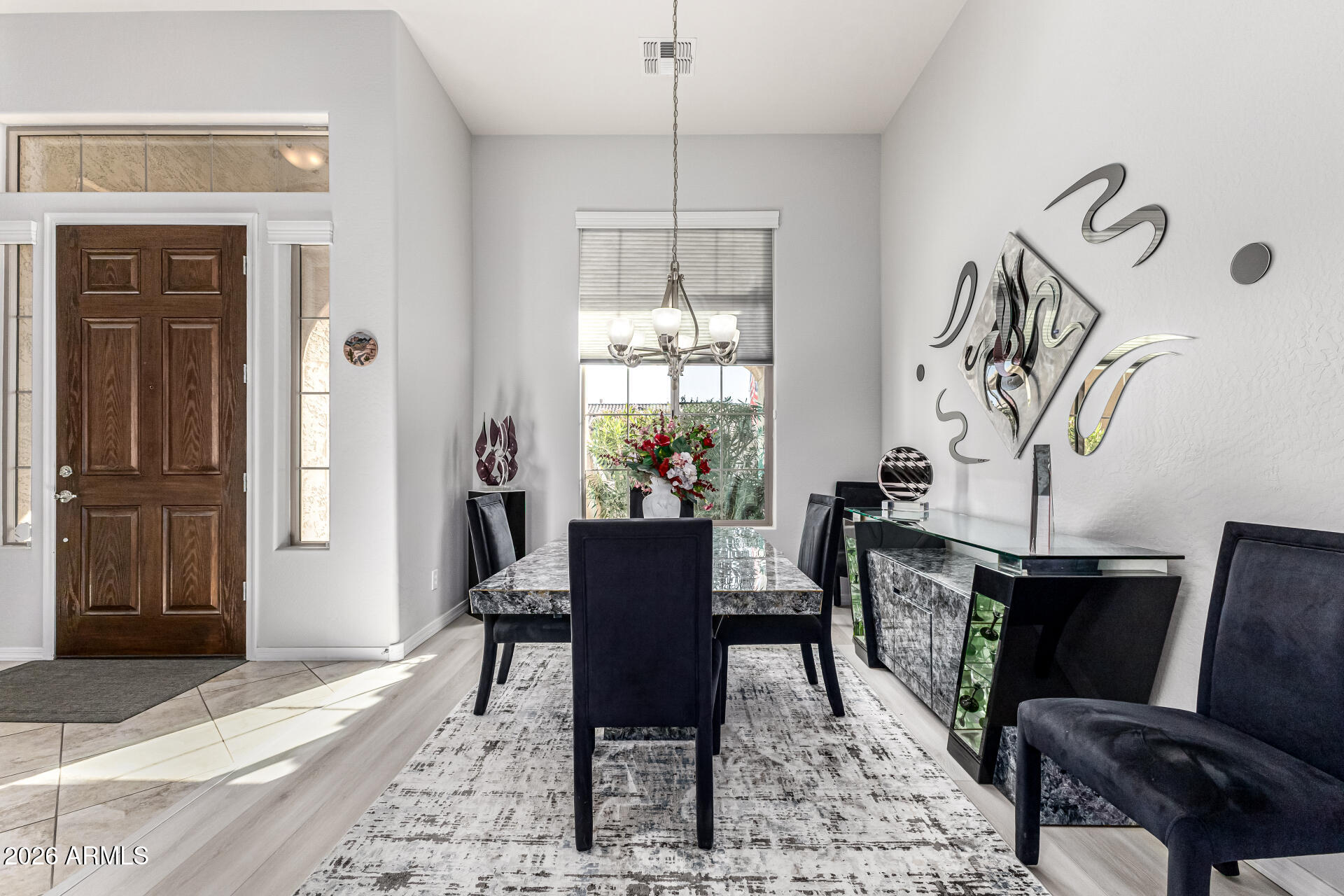 17926 West Griswold Road Waddell, AZ 85355 - Photo 3 of 73 a view of a dining room with furniture