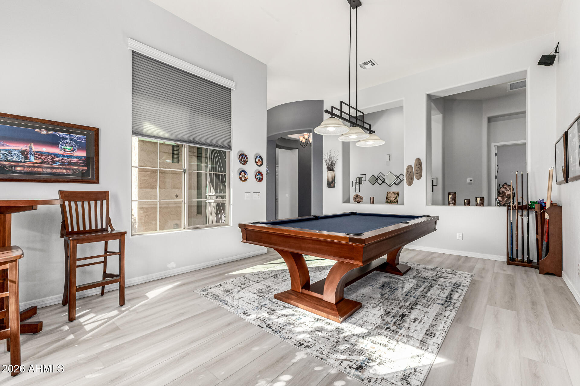 17926 West Griswold Road Waddell, AZ 85355 - Photo 4 of 73 a room with pool table and windows