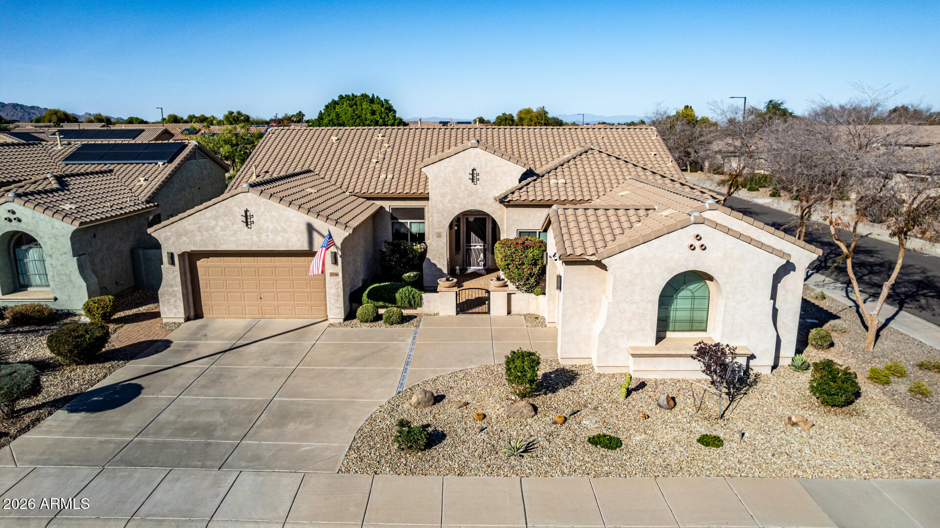 17926 West Griswold Road Waddell, AZ 85355 - Photo 55 of 73 a view of a white house with a outdoor space