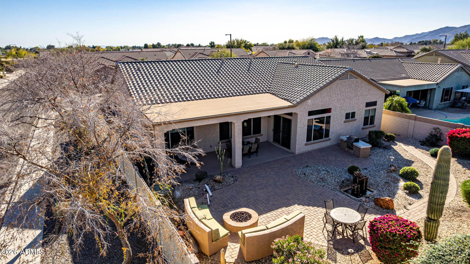 17926 West Griswold Road Waddell, AZ 85355 - Photo 62 of 73 a view of a patio with table and chairs