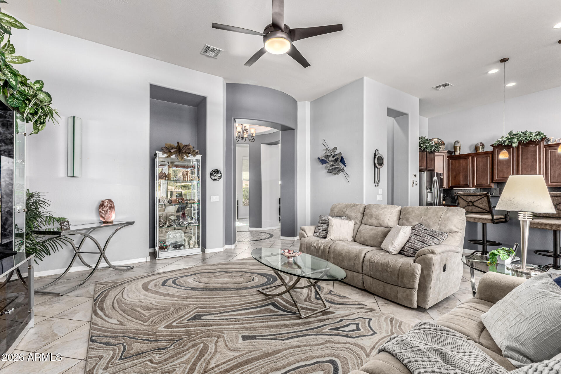 17926 West Griswold Road Waddell, AZ 85355 - Photo 7 of 73 a living room with furniture and a large window