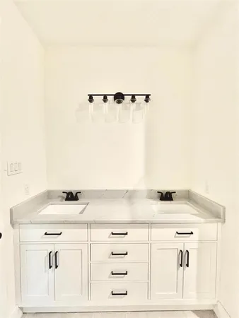 a view of white cabinets and window