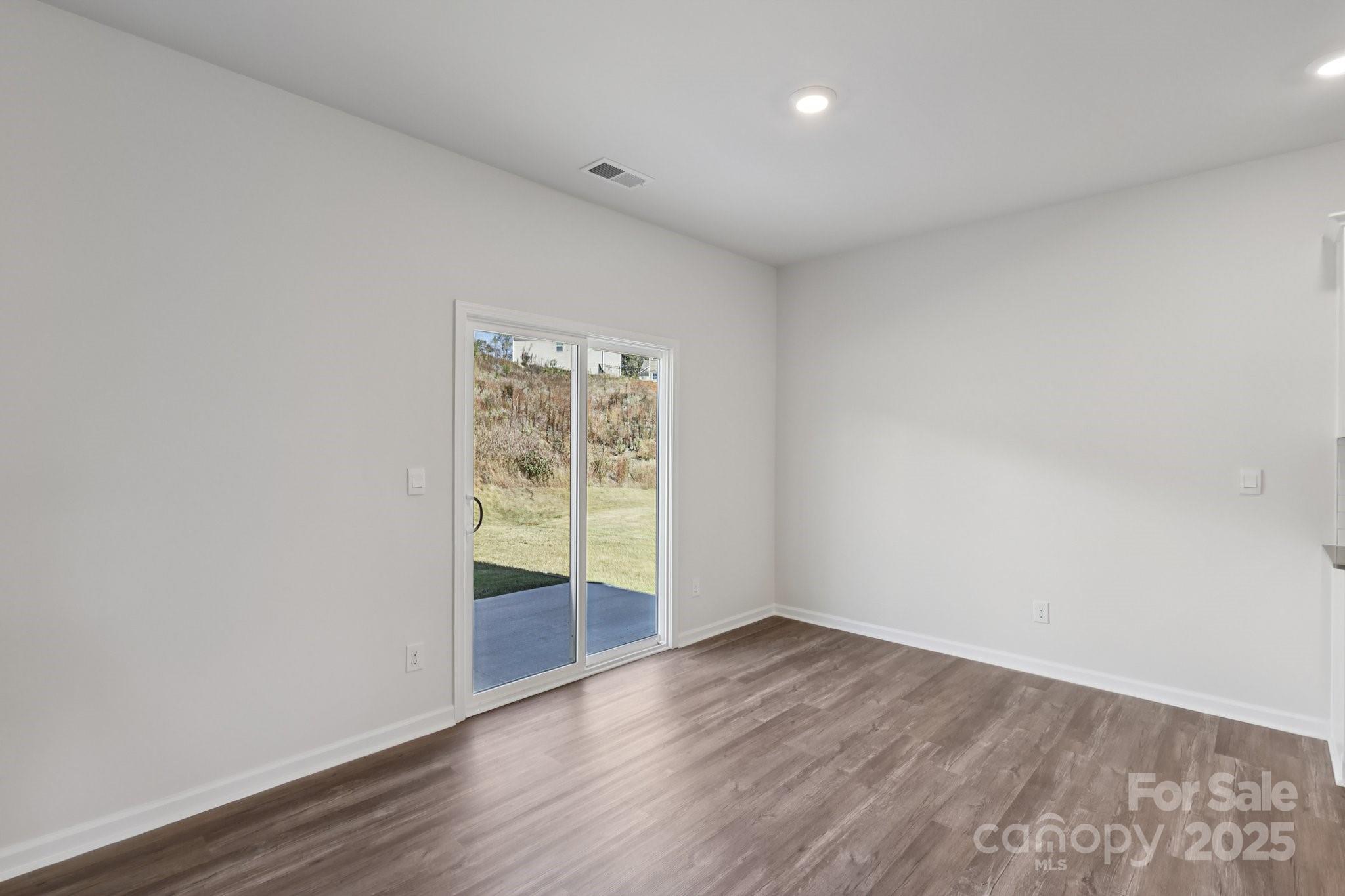 3964 Ashton Drive Northwest Conover, NC 28613 - Photo 11 of 44 wooden floor in an empty room with a window
