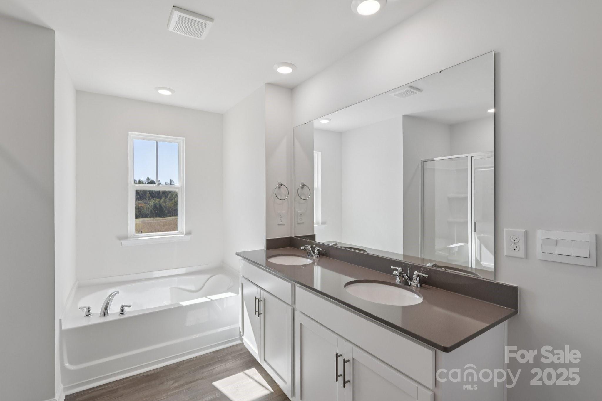 3964 Ashton Drive Northwest Conover, NC 28613 - Photo 25 of 44 a bathroom with a granite countertop sink and a bathtub