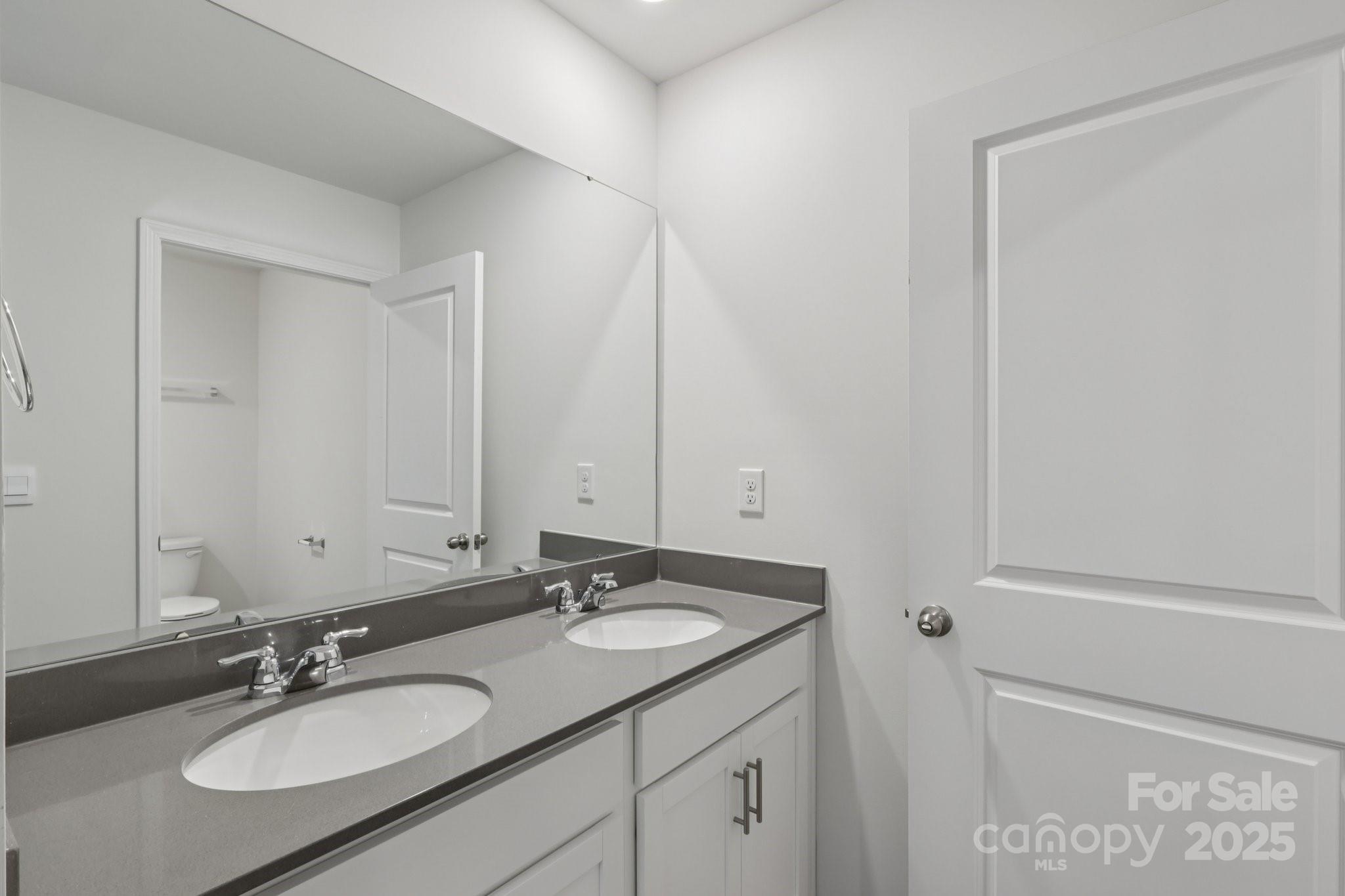 3964 Ashton Drive Northwest Conover, NC 28613 - Photo 41 of 44 a bathroom with a granite countertop sink and a mirror