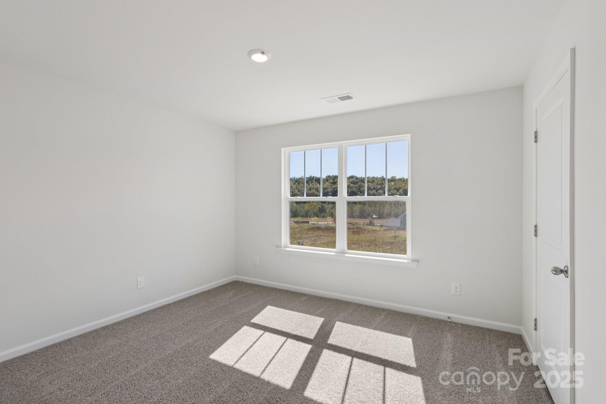 3964 Ashton Drive Northwest Conover, NC 28613 - Photo 43 of 44 an empty room with a window