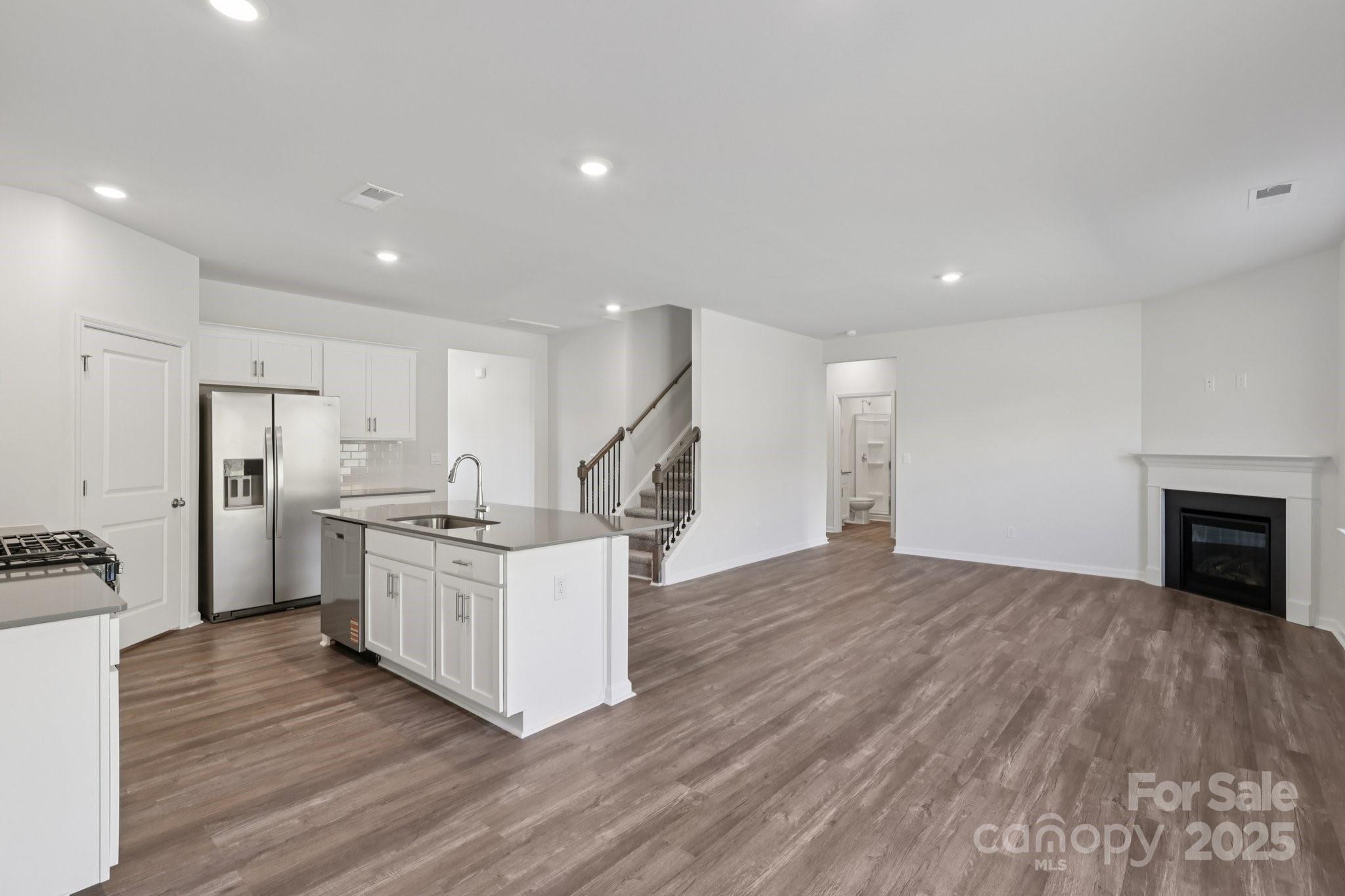 3964 Ashton Drive Northwest Conover, NC 28613 - Photo 9 of 44 a kitchen with white cabinets and stainless steel appliances