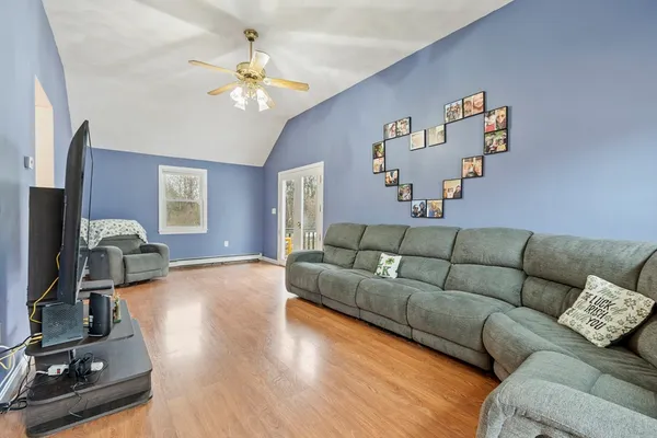 a living room with furniture and a flat screen tv