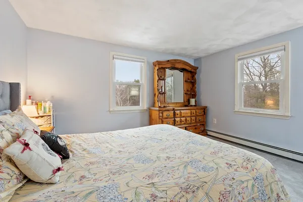 a bedroom with a bed and a desk