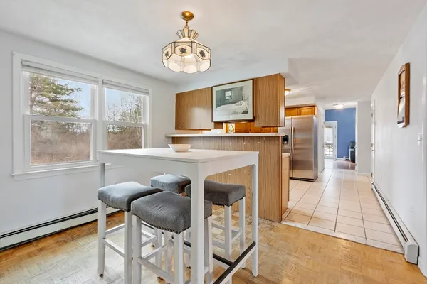 a view of kitchen with furniture and a fireplace