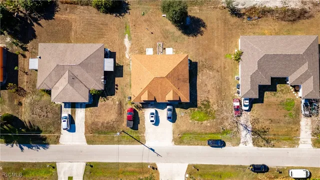 an aerial view of houses with outdoor space
